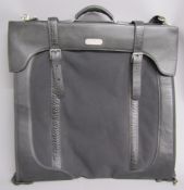 Samsonite Black Label garment bag by Alexander McQueen with black and white feather design liner and