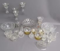 Collection of glassware includes grapefruit dishes, fruit bowls, candle holders, jugs, glasses,