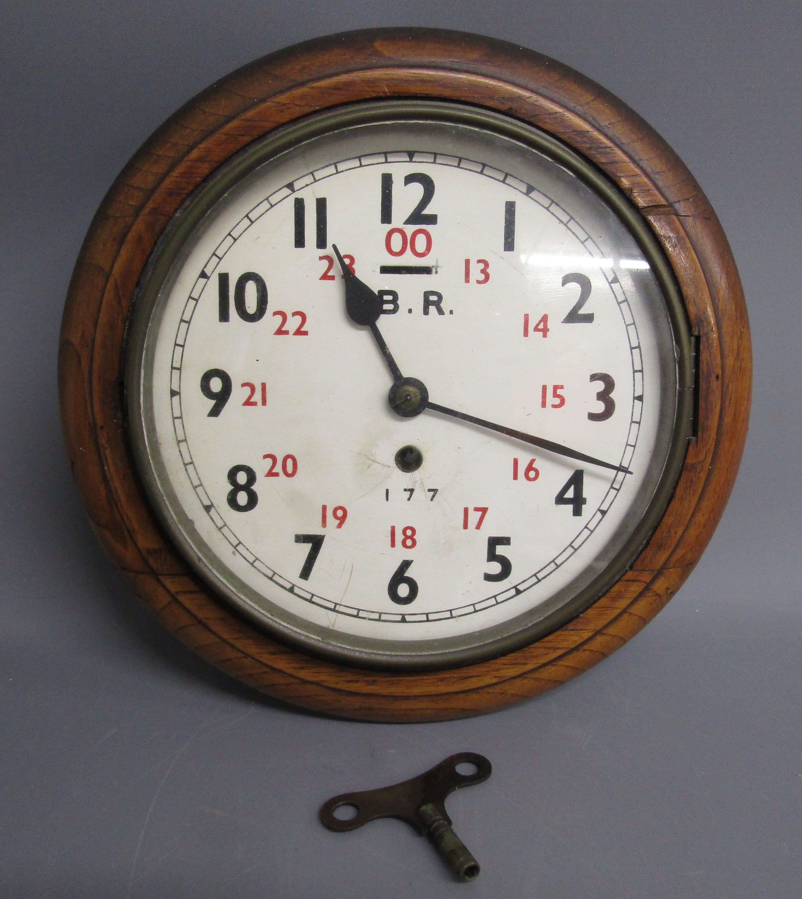 8" Railway clock with wooden surround - possibly John Walker - marked B.R 177 to face - the back has