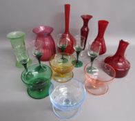 Coloured glass includes pink Dartington crystal vase, red glass vases and jug, green twist stem