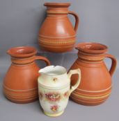 3 Wedgwood  terracotta decorated 'Cambridge' ale jugs - 2 approx. 20cm tall & 1 approx. 18cm tall