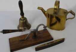 Antique brass hot water can, pair of sugar cutters mounted on a wooden base, brass hand bell, Rabone