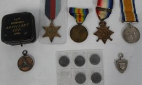 World War 1 trio of medals, Divisional Artillery Cup medal, 5 German coins, silver fob and World War