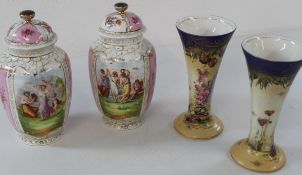 Pair of Dresden style porcelain lidded vases with transfer printed decoration and blue printed cross