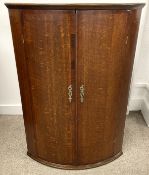 Georgian oak bow fronted corner cupboard with cross banding to the doors W 71cm D 50cm Ht 101cm