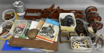 Model steam locomotive chassis, wheels & other parts along with model train books & plans for a