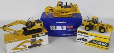 Komatsu PC200 Excavator 1/43, Komatsu WA350 Wheel loader 1/50, Komatsu D475A Bulldozer 1/50.
