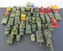 Large quantity of diecast cars, tanks, trucks, bikes etc as well as spare parts, mostly Dinky