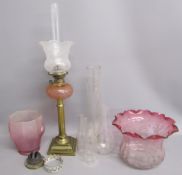 Small cranberry glass oil lamp, 2 lamp shades and chimneys