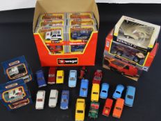 18 boxed 1/43 Burago models in outer display sleeve, 1 Burago 1/32 model car, Corgi Renault 11