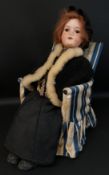 Armand Marseille bisque head doll (390) on composition body with ball and socket knee and elbow