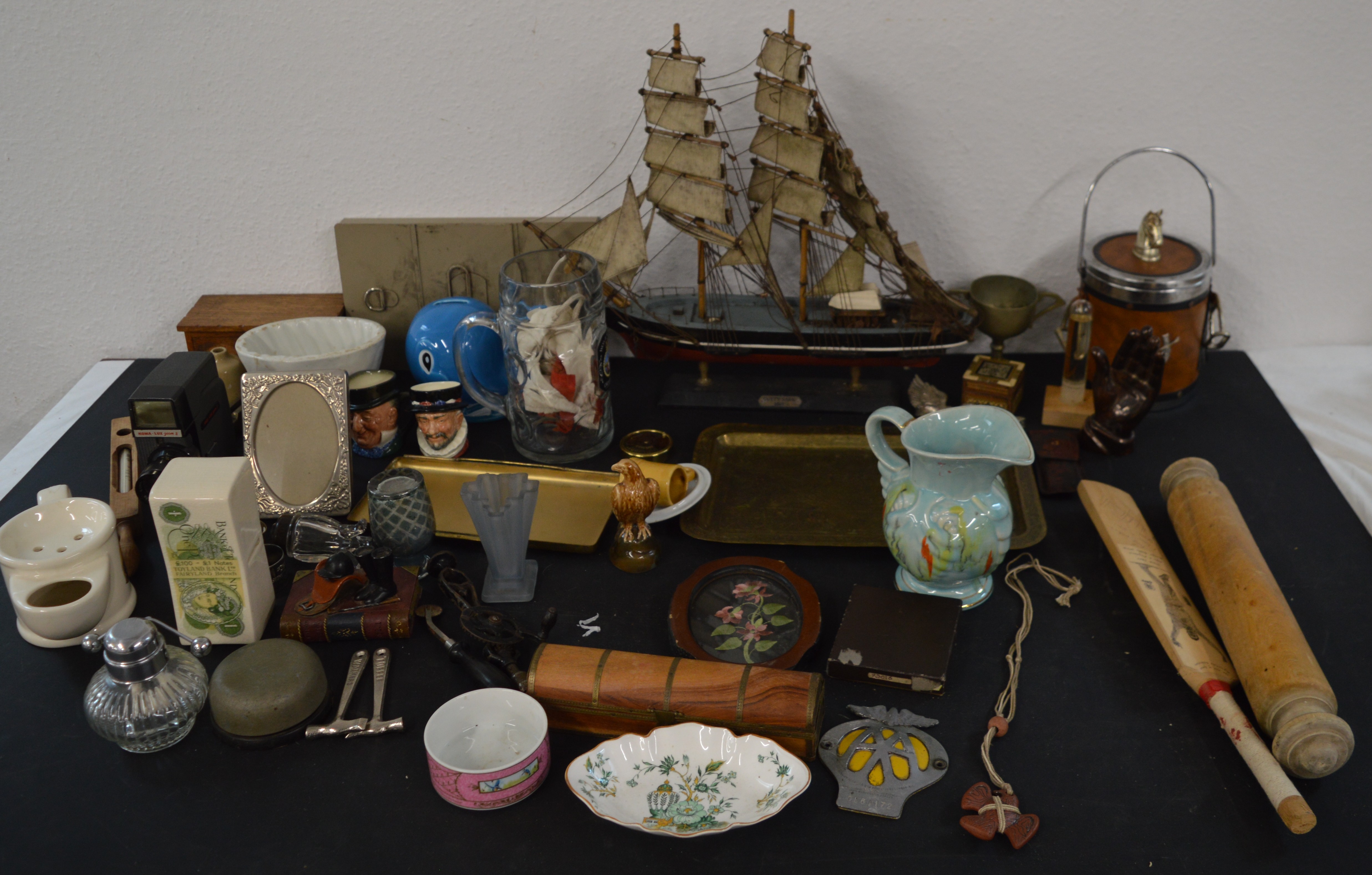 Mixed box of ceramics and decorative ornaments, including a wooden model ship, miniature cricket bat