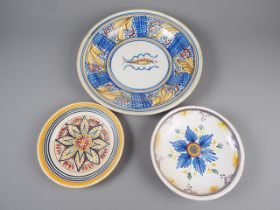 A Continental Faience dish with central fish decoration, 13 1/2” dia, and two similar smaller