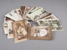 A collection of early 20th century postcards, various