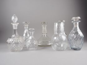 A pair of cut glass decanters, one engraved on base "Richardson Britain", four other decanters and