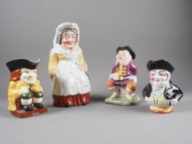 A 19th century Martha Gunn jug, 9 1/2" high, two Toby jugs and one other character jug