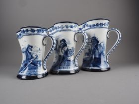 A set of three Royal Doulton graduated jugs, blue and white transfer decoration of old mariners,