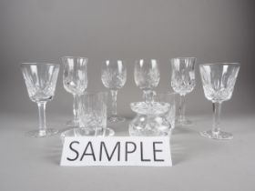 A set of six Waterford Crystal white wine glasses, a pair of Waterford Crystal brandy balloons