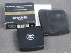 Chanel makeup compact in original packaging.