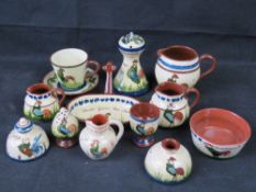 Torquay / Devon motto ware pottery; various items with green cockerel design,