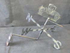 A vintage car themed weather vane.