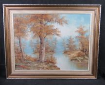 A 20th century oil painting of woodland scene, framed.