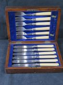 Silver plated fish knives and forks in box.