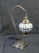 A mosaic glass lantern style table lamp.