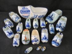 A Heineken Carlton Ware clog together with a quantity of Delft clogs.