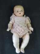 A early 20th century Hugo Wiegand baby doll.