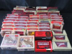 A collection of Matchbox Days Gone By Yesteryear vehicles including five red London buses.
