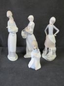 Four Lladro figurines.