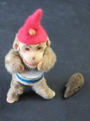 Two vintage clockwork toys being money and mouse.