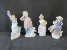 Two Lladro and two Nao figurines.