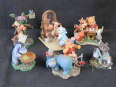 A quantity of Winnie the Pooh figurines, one noted a/f.