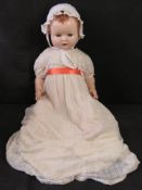 A 1950s Sarold doll, hard plastic, jointed, moulded hair and voice box (not functioning).