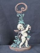 A cast iron cherub door stop.