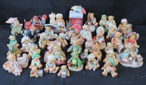 A large quantity of Cherished Teddies figurines.