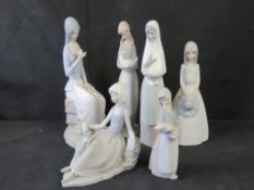 Two Lladro figurines, one Nao figurine and three other Spanish ceramic figurines. Six items.