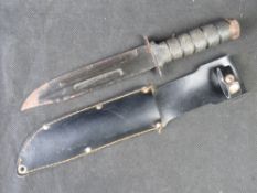 A black dagger with sheath.