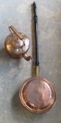 A copper kettle and a copper warming pan.