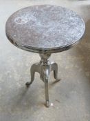 A chrome wine table.