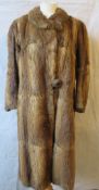 A ladies vintage 3/4 length fur coat.