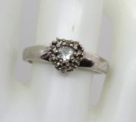A 9ct white gold ring set with white stones in heart form, size N, 3.1g.