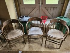 Three early 20th century spindle back smokers or elbow chairs.
