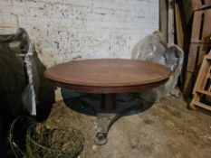 A mahogany coffee table raised over triform base, approx 106cm dia.