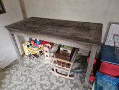 A wooden garden table, 150 x 70cm.