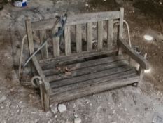 A wooden child's swing bench, approx 71cm wide.
