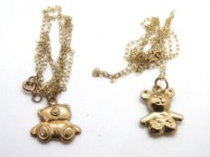Two 9ct gold teddy bear pendants on chains, total weight 1.8g.