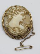 A carved shell cameo in 12ct rolled gold frame by Clewco.